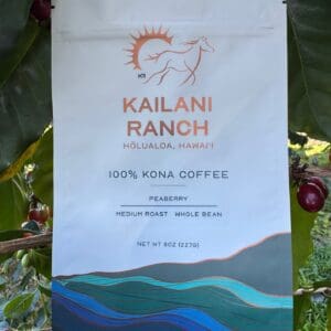 A bag of kona coffee sitting on top of a tree.